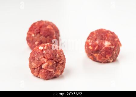 Raw beef meatballs on white background Stock Photo