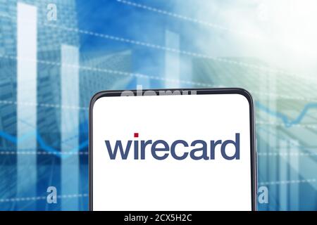 WETZLAR, GERMANY, 2019-02-08  WIRECARD  LOGO on a smartphone. Concept with skyscraper with blurred focus in background. Stock Photo