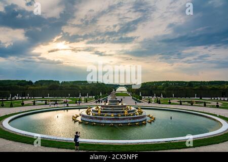 Versailles, France - August 27, 2019 : Tourists visiting latona Fountain and great perspective of Versailles Chateau gardens. Stock Photo