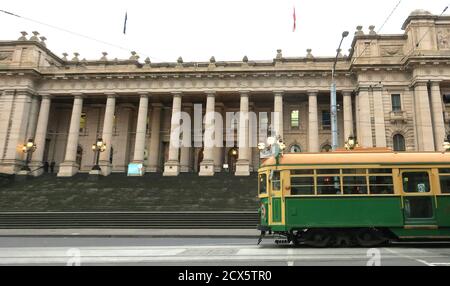 Melbourne Australia; Heritage views, a historic W-Class tram rolls past the historic Parliament House in Melbourne . Stock Photo