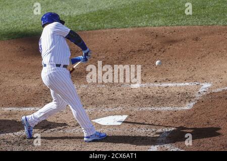 Chicago, United States. 30th Sep, 2020. Chicago Cubs' Ian Happ (8) hits a solo home run against the Miami Marlins in the fifth inning of the NL Wild Card Game at Wrigley Field on Wednesday, September 30, 2020 in Chicago. Photo by Kamil Krzaczynski/UPI Credit: UPI/Alamy Live News Stock Photo