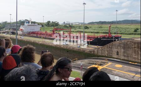 Panama Canal, Panama, Dec 5, 2017 - Audience watches as ship is moved through the Panama Canal Stock Photo