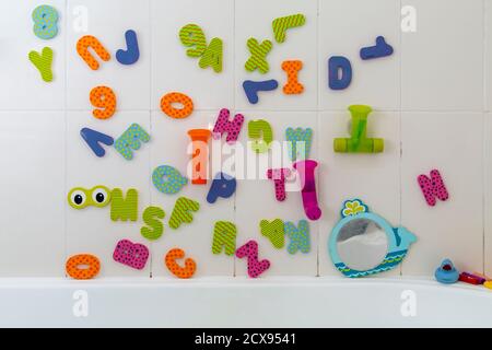 Childs alphabet bath toys in bathroom Stock Photo - Alamy