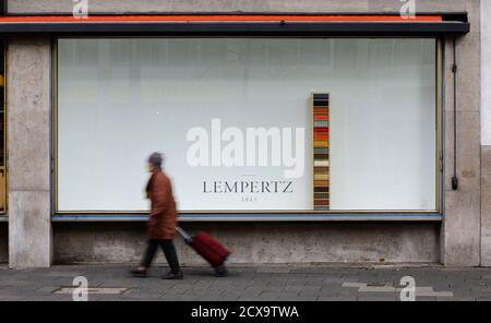 A woman walks past an exhibition window of Cologne auction house Lampertz November 4, 2013, who auctioned a German expressionist painting on behalf of Cornelius Gurlitt. The painting from 1930 was auctioned for 720,000 euros in 2011 by Lempertz on behalf of Cornelius Gurlitt, son of art dealer Hildebrand Gurlitt, who was a specialist in the modern art of the early 20th century that the Nazis branded as 'degenerate art'. A vast trove of modern art seized under Germany's Nazi regime was discovered in a Munich apartment belonging to Gurlitt, among stacks of rotting groceries, German magazine Focu
