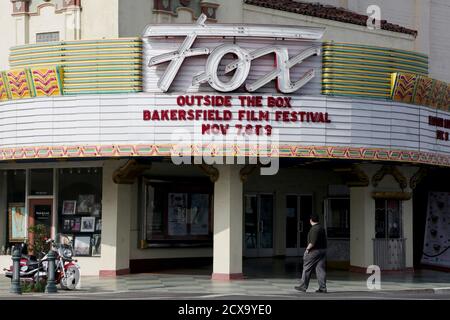 A man walks past the Fox Theater, which originally opened in 1930, in downtown Bakersfield, California November 9, 2014. REUTERS/Jonathan Alcorn  (UNITED STATES - Tags: SOCIETY)