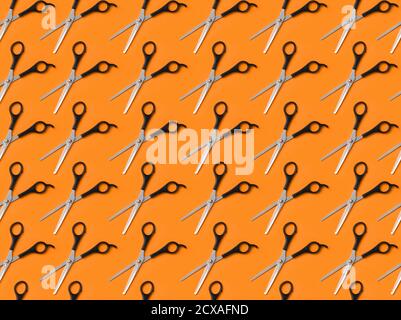 Many professional hairdresser's scissors on color background Stock Photo