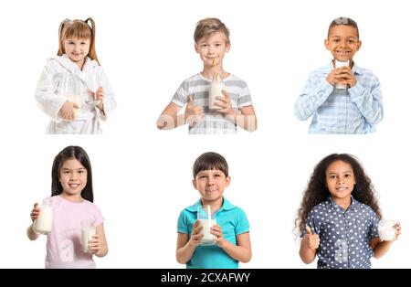 Different little children with milk on white background Stock Photo