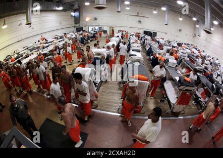 Inmates walk around a gymnasium where they are housed due to overcrowding at the California Institution for Men state prison in Chino, California, June 3, 2011. The Supreme Court has ordered California to release more than 30,000 inmates over the next two years or take other steps to ease overcrowding in its prisons to prevent 'needless suffering and death.' California's 33 adult prisons were designed to hold about 80,000 inmates and now have about 145,000. The U.S. has more than 2 million people in state and local prisons. It has long had the highest incarceration rate in the world. REUTERS/L