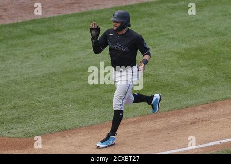 Chicago, United States. 30th Sep, 2020. Miami Marlins' Miguel Rojas (19) runs to score against the Chicago Cubs in the seventh inning of the NL Wild Card Game at Wrigley Field on Wednesday, September 30, 2020 in Chicago. Photo by Kamil Krzaczynski/UPI Credit: UPI/Alamy Live News Stock Photo