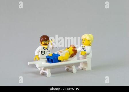 Florianopolis, Brazil. September 19, 2020: Minifigure of a boy lying on a stretcher crying for an injection. Vaccination is important for children's h Stock Photo