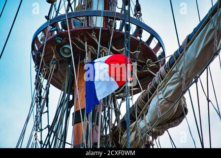Nautical tackles and equipment of the old tall ship. Rigging ropes and rope ladder on the mast of sailing vessel as abstract background for your marin Stock Photo