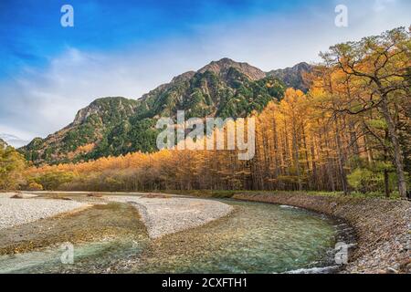 Nature landscape at Kamikochi Japan, autumn fall foliage with pond and mountain Stock Photo