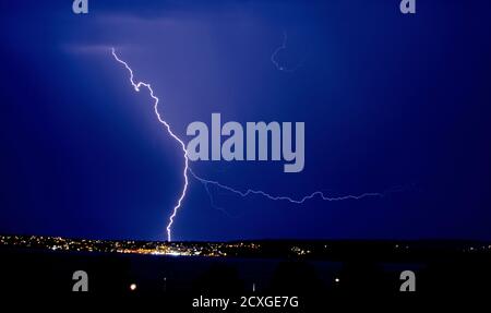 Fork Lightning over Torquay Harbour.  Thunderstorm with zig zag lighting . Stock Photo