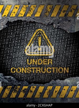 Under construction sign on rusty metal background Stock Photo