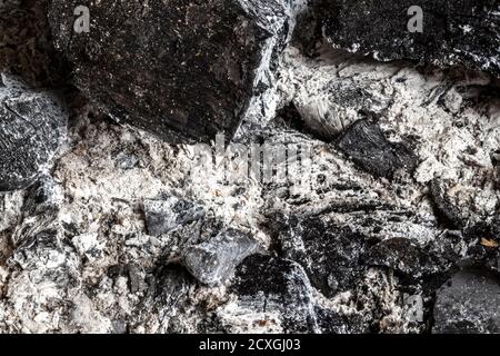 Burnt ash in the barbecue close-up as a background. Stock Photo