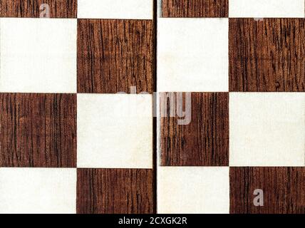 A fragment of a handmade lacquered chessboard. Stock Photo