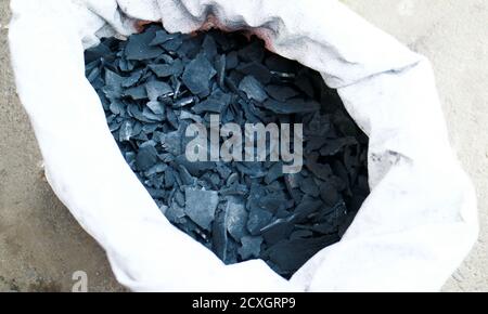 Coconut shell charcoal in sacks. Used for cooking. Stock Photo