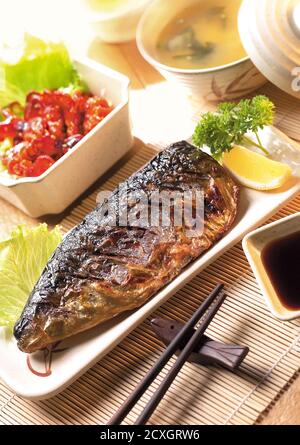 Saba fish teriyaki with rice soup and salad on wood background ...