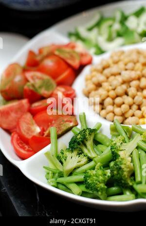 Delicious fresh salads on the buffet table at restaurant Stock Photo
