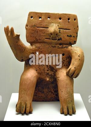 Seated human figure with tumbaga decoration. Ceramic and gold. Quimbaya culture.1200-1500 AD. Colombia, Colombian, America, American, Stock Photo