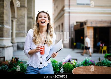 Beautiful young happy cheerful woman enjoying her time and freedom Stock Photo