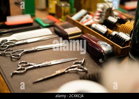 Hairdressing tools arranged on table Stock Photo