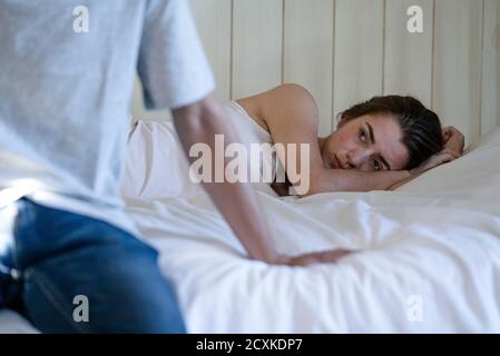 Young couple having relationship difficulties in the bedroom Stock Photo