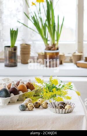 Preparing for Easter, Yellow boquet an Easter eggs Stock Photo