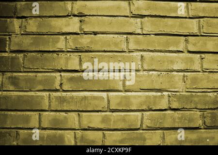 Beautiful old brick wall surface with yellow light. Abstract yellow vintage wall texture Stock Photo