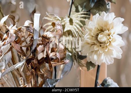 Christmas decorations - artificial flowers on blurred background.Selective focus. Stock Photo