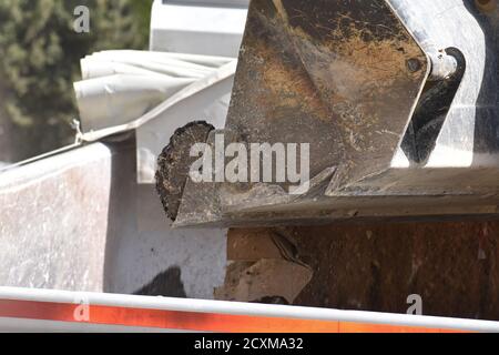 Digger emptying it's bucket of construction debris , Finland Stock