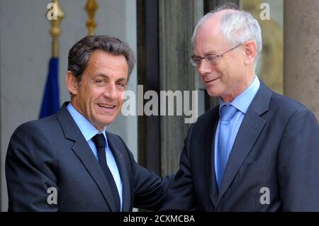 France's President Nicolas Sarkozy (L) welcomes President of the European Council Herman Van Rompuy at the Elysee Palace in Paris, June 15, 2011.  REUTERS/Philippe Wojazer  (FRANCE)