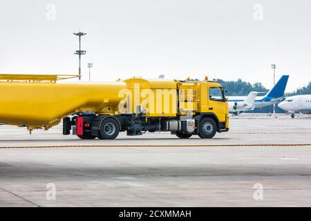 Yellow tank truck aircraft refueler at the airport apron Stock Photo ...
