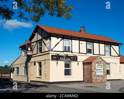 The Victoria pub and restaurant next to Cattal railway station near Knaresborough North Yorkshire England Stock Photo