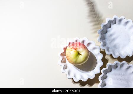 Ceramic handmade products. Concept homemade fall baking with apple. Stock Photo