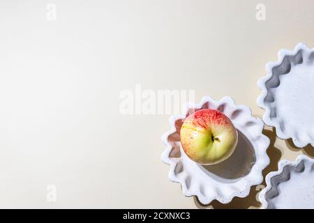 Ceramic handmade products. Concept homemade fall baking with apple. Stock Photo