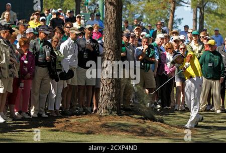 Hideki Matsuyama of Japan hits from under a tree on the 11th fairway during second round play in the 2012 Masters Golf Tournament at the Augusta National Golf Club in Augusta, Georgia, April 6, 2012.  REUTERS/Mark Blinch (UNITED STATES  - Tags: SPORT GOLF)