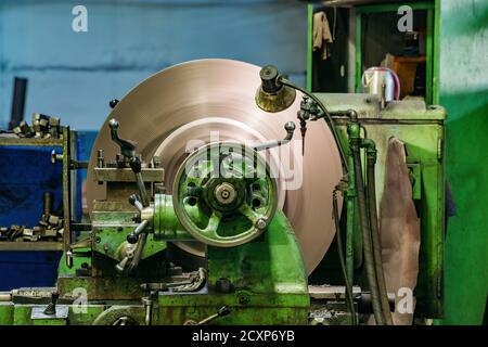 Working green lathe in the metalworking workshop Stock Photo