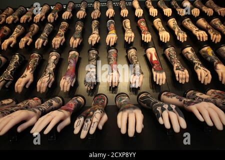 Ayr, Ayrshire, Scotland, UK 19 Jan 2019, An exhibition celebrating the art of tattoo at Rozelle Park.. Photo shows display of tattoos on arms Stock Photo