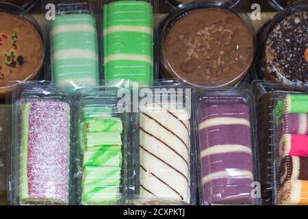 Chinese and Asian food on the market, rice, chips, noodles, sweets. Stock Photo