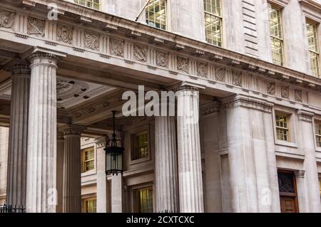 London, United Kingdom - September 14, 2017: Greek stone columns. Classical example of architecture in famous downtown of London. Stock Photo