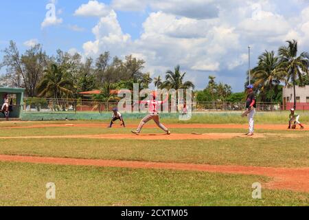 Kids and teenagers play in a baseball game for team selection in Mantanzas baseball ground, Cuba Stock Photo