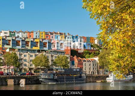 BRISTOL CITY ENGLAND  HOTWELLS DOCKS GRAIN BARGE LATE SUMMER LEAVES AND  THE COLOURED HOUSES OF CLIFTON WOOD AND AMBRA VALE Stock Photo