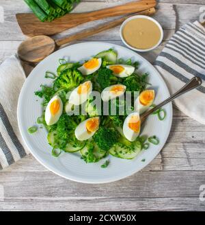 green vegetarian salad with boiled eggs