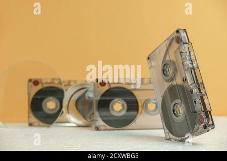 Close up Audio cassette tape on a white table and yellow space.Minimalism retro style concept. 80s. Background pattern for design. Stock Photo