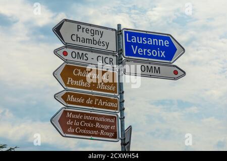 Geneva, Switzerland - Aug 16, 2020: road signs of the United Nations area. World Meteorological Organization OMM, World Health Organization OMS and Stock Photo