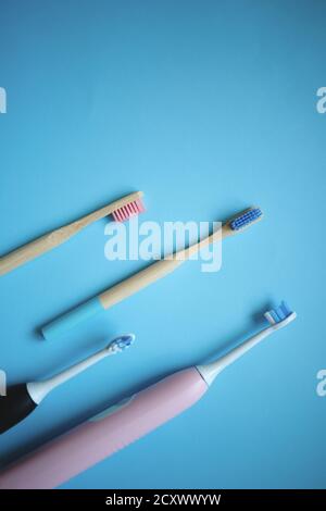 two ultrasonic electric toothbrushes on a blue background Stock Photo