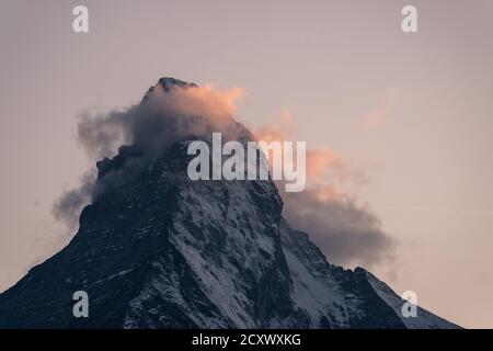 Last light of the sunset over the Matterhorn peak in Zermatt in Valais, Switzerland Stock Photo