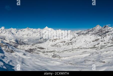 Panoramic view of the famous Zermatt ski resort in the alps in Canton Valais in Switzerland on a sunny winter day Stock Photo