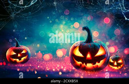Halloween Abstract Party - Smiling Pumpkins On Defocused Shiny Background Stock Photo